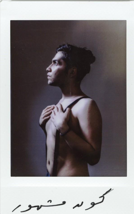 black and white photo of shirtless individual facing to the side